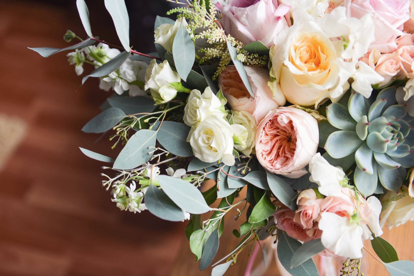 Wedding floral arrangement with roses and succulents