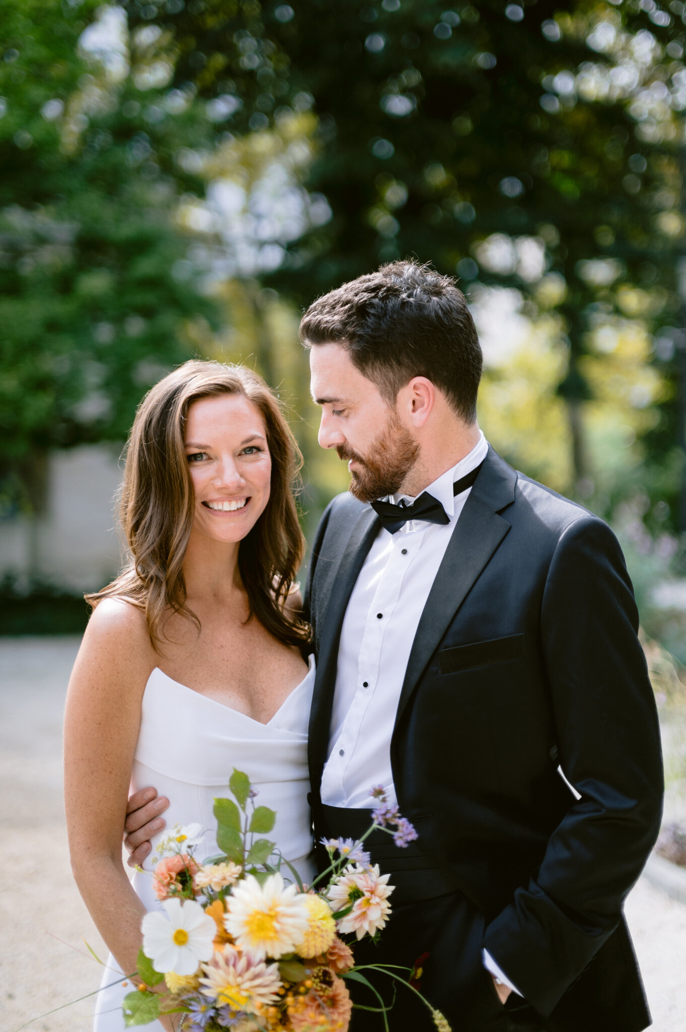 Wedding couple portrait with floral bouquet